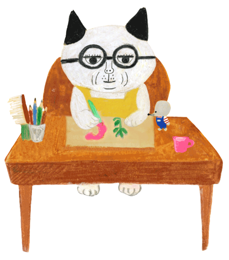 机で作業するめがねこさん。イラストのアイデアを考えています。